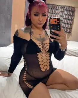 Redhead goth woman with tattoos